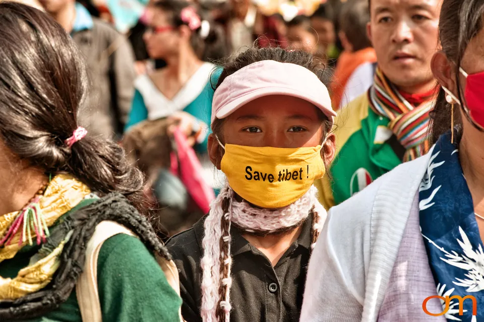 Child Wearing “Save Tibet” Mask in Salugara